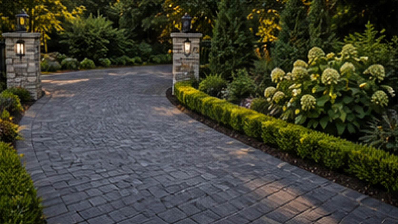 Driveway Entrance Landscaping Ideas with dark pavers